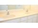 Bright bathroom vanity featuring double sinks with white cabinetry at 3553 Old Maple Dr, Johns Creek, GA 30022