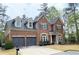 Lovely two story brick home with dormer windows and attached two car garage at 3553 Old Maple Dr, Johns Creek, GA 30022