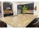 Close up of kitchen island featuring granite countertops and stainless steel appliances at 3553 Old Maple Dr, Johns Creek, GA 30022