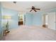 Spacious light blue bedroom offers view of ensuite bathroom and hall access at 810 Towergate Pl, Atlanta, GA 30350