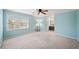 Spacious light blue bedroom offers view of ensuite bathroom and natural light at 810 Towergate Pl, Atlanta, GA 30350