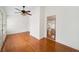 Bright dining room features hardwood floors, ceiling fan and natural light from the windows at 810 Towergate Pl, Atlanta, GA 30350