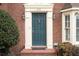 Inviting front entrance featuring a classic teal door and decorative architectural details at 810 Towergate Pl, Atlanta, GA 30350