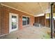 Brick patio with a door and window offering an outdoor area for relaxing or entertaining at 810 Towergate Pl, Atlanta, GA 30350