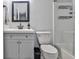 Modern bathroom with a vanity, framed mirror, and a shower with a clear glass door for a sleek look at 15 Pine Canyon Sw Dr, Atlanta, GA 30331