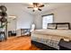 Cozy bedroom features wood floors, natural light and stylish decor at 15 Pine Canyon Sw Dr, Atlanta, GA 30331