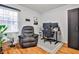 Comfortable living room featuring a recliner, natural light, and adjacent workstation at 15 Pine Canyon Sw Dr, Atlanta, GA 30331