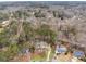 An aerial view showcasing the home's location in a beautiful wooded neighborhood at 6664 Windwood Cir, Douglasville, GA 30135