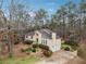 Overhead of the home showing the roof, two-car garage, front yard and surrounding trees at 6664 Windwood Cir, Douglasville, GA 30135