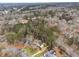 An aerial view showcasing the home's location in a beautiful wooded neighborhood at 6664 Windwood Cir, Douglasville, GA 30135
