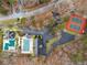 Aerial view of neighborhood clubhouse, parking, swimming pools and tennis courts at 6664 Windwood Cir, Douglasville, GA 30135