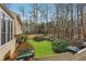 Beautiful backyard featuring lush grass and landscaped garden at 6664 Windwood Cir, Douglasville, GA 30135