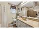 Bathroom features framed mirror and tiled shower and floors at 6664 Windwood Cir, Douglasville, GA 30135