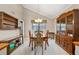 Dining room featuring a table with seating for six and a wooden china cabinet at 6664 Windwood Cir, Douglasville, GA 30135