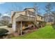 Exterior elevation of two story home with wooded backyard at 6664 Windwood Cir, Douglasville, GA 30135