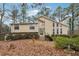 Inviting front exterior featuring a unique architectural design and natural stone accents at 6664 Windwood Cir, Douglasville, GA 30135