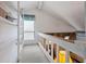 Upstairs hallway with natural light, built-in shelving, and a view of the lower living area at 6664 Windwood Cir, Douglasville, GA 30135