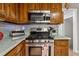 Kitchen features stainless steel appliances, including oven, range and microwave at 6664 Windwood Cir, Douglasville, GA 30135