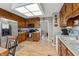 Spacious kitchen featuring wood cabinets, tile backsplash, and stainless steel appliances at 6664 Windwood Cir, Douglasville, GA 30135