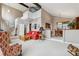 Open living room featuring high ceilings and a view into the adjacent dining area at 6664 Windwood Cir, Douglasville, GA 30135