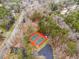 Aerial view showcases multiple tennis courts with green surfaces and red borders at 6664 Windwood Cir, Douglasville, GA 30135
