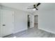 Bedroom featuring wood-look floors, doors, and an open doorway to the bathroom at 2381 Highpoint Rd, Snellville, GA 30078