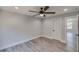 Bedroom features recessed lights, gray wood floors, and a door leading to another room at 2381 Highpoint Rd, Snellville, GA 30078