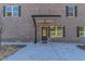 Close up of the front door and covered entrance of a brick duplex at 2381 Highpoint Rd, Snellville, GA 30078