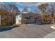 Side view of a gray brick duplex with black shutters surrounded by mature trees at 2381 Highpoint Rd, Snellville, GA 30078