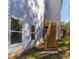 Back of home with two-story deck and natural wood stairs at 2381 Highpoint Rd, Snellville, GA 30078