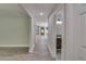 Hallway featuring wood-look floors and a partial view of the half bathroom at 2381 Highpoint Rd, Snellville, GA 30078