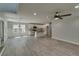 Open-concept living area with light gray walls and wood grain vinyl floors at 2381 Highpoint Rd, Snellville, GA 30078