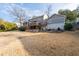 Large backyard with a deck, screened porch, and a patio with a fire pit at 343 Woodstone Dr, Marietta, GA 30068