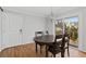 Bright dining area with hardwood floors, access to deck, and modern lighting at 343 Woodstone Dr, Marietta, GA 30068