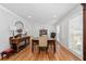 Traditional dining room featuring hardwood floors, large windows, and ample space for entertaining at 343 Woodstone Dr, Marietta, GA 30068