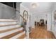 Inviting foyer with hardwood floors and an archway leading to the dining room at 343 Woodstone Dr, Marietta, GA 30068