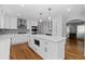 Spacious kitchen with white cabinetry, a large island with seating, and stainless steel appliances at 343 Woodstone Dr, Marietta, GA 30068