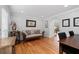 Bright living room featuring hardwood floors, natural light, and comfortable seating at 343 Woodstone Dr, Marietta, GA 30068