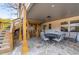 Charming covered patio featuring stone flooring, exposed wood, and a seating area for outdoor relaxation at 343 Woodstone Dr, Marietta, GA 30068