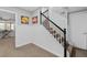 Carpeted staircase with black handrail and white balusters, leading to the upper level of the home at 343 Woodstone Dr, Marietta, GA 30068