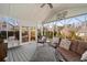 Relaxing sunroom with large windows offering great views, comfortable seating, and screened windows at 343 Woodstone Dr, Marietta, GA 30068