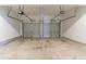 Two-car garage with stained concrete floor at 610 Maltese Dr, Atlanta, GA 30349