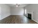 Bright living room boasts wood floors, fireplace, and ceiling fan at 610 Maltese Dr, Atlanta, GA 30349