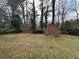 Backyard featuring a storage shed and partial gazebo, perfect for outdoor storage and leisure at 1046 Sans Souci Way, Clarkston, GA 30021