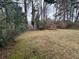 Wide backyard view with shed, showcasing ample space for gardening, recreation, and outdoor enjoyment at 1046 Sans Souci Way, Clarkston, GA 30021