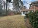 Spacious backyard featuring a storage shed, offering ample outdoor space and extra storage at 1046 Sans Souci Way, Clarkston, GA 30021