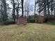 Backyard featuring a storage shed, offering extra space for outdoor equipment and storage at 1046 Sans Souci Way, Clarkston, GA 30021