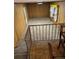 View of a basement with carpeted floors and wood-paneled walls, accessible by a carpeted staircase at 1046 Sans Souci Way, Clarkston, GA 30021