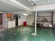 Spacious basement area featuring shelving, storage, and utility connections for laundry at 1046 Sans Souci Way, Clarkston, GA 30021