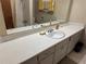 Bathroom with an extended counter space, a large mirror, and yellow floral curtains at 1046 Sans Souci Way, Clarkston, GA 30021